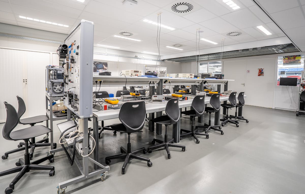 Industrial workshop interior with machinery for valve refurbishment