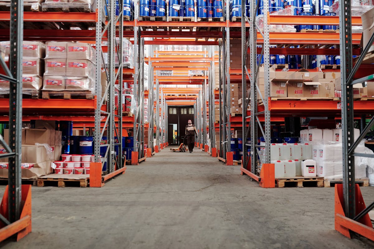 Warehouse shelving stocked with industrial valves and fittings